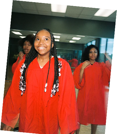 A girl walking and looking upwards and smiling
