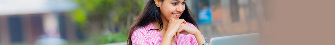 Girl sitting infront of laptop