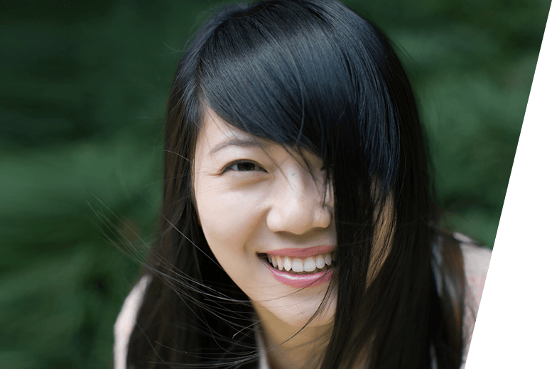 Close-up of young woman smiling